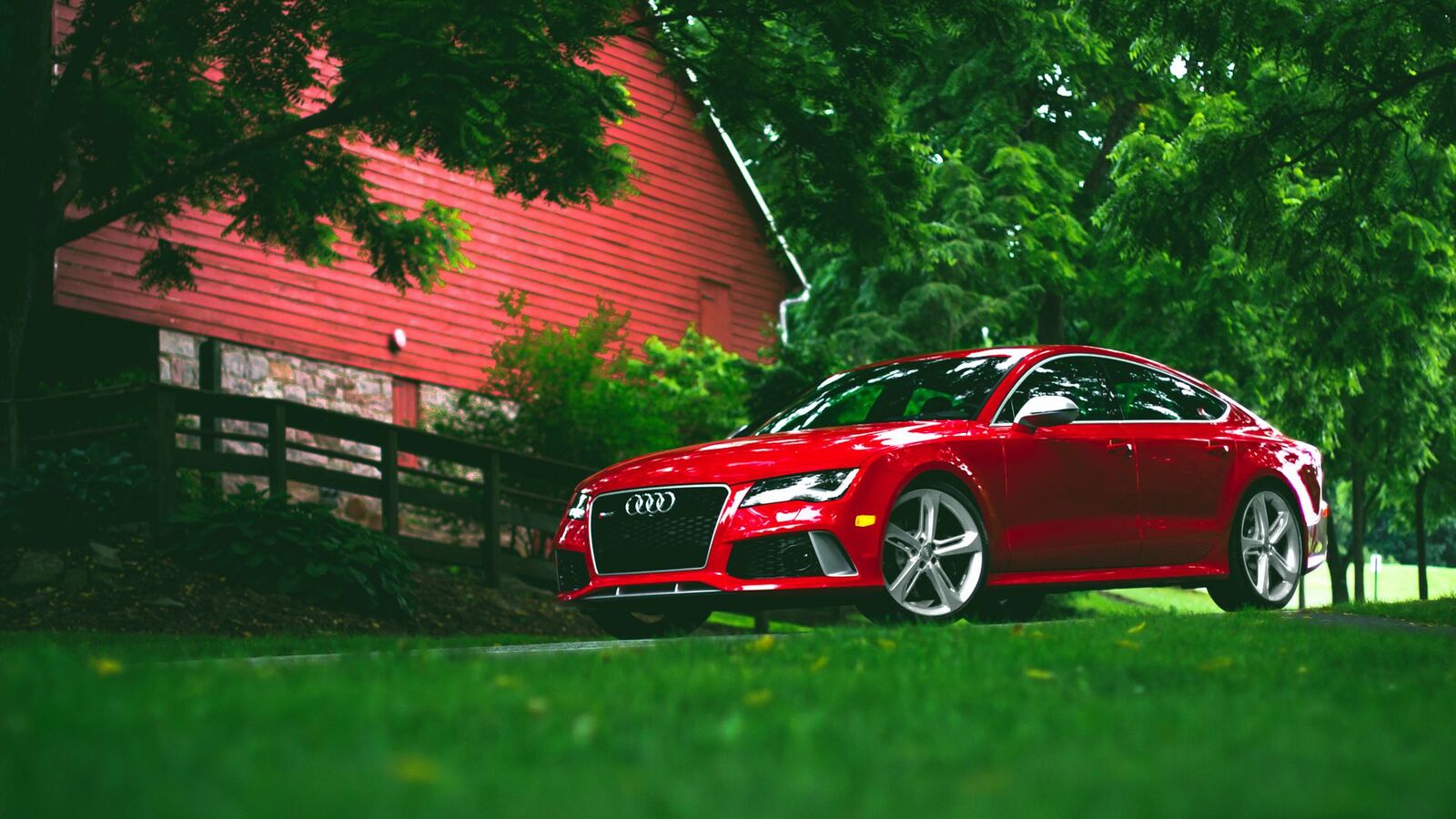 audi_rs7_red_grass_side_view_99465_1920x1080.jpg