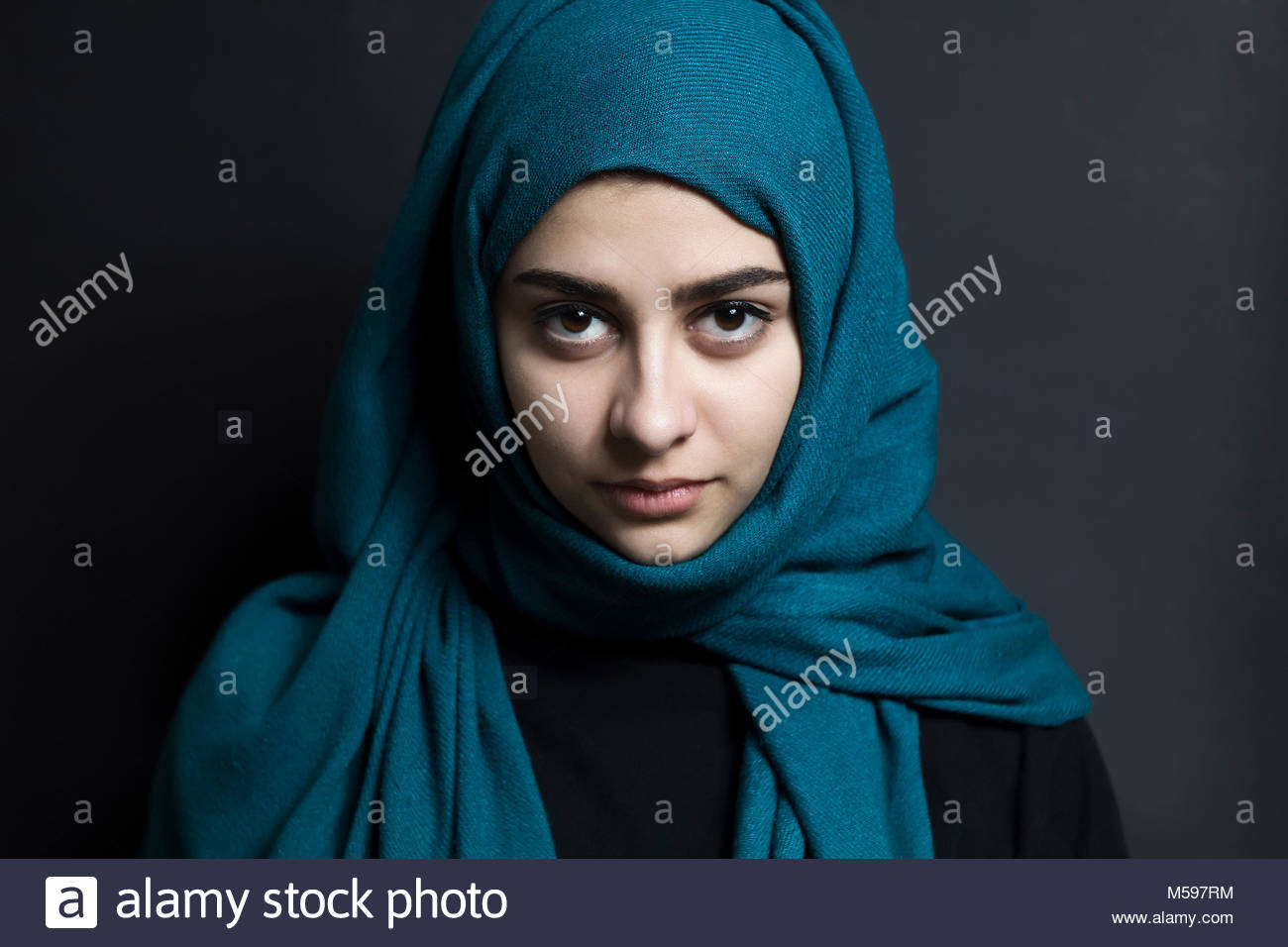 -with-eyes-on-a-black-background-arab-woman-M597RM.jpg