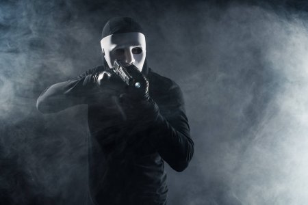 90751652-stock-photo-man-mask-balaclava-aiming-gun.jpg